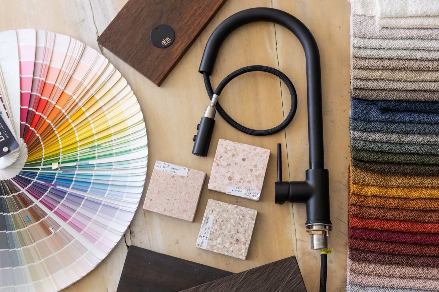 Design team collaborating at a table with brand samples for Ahti.