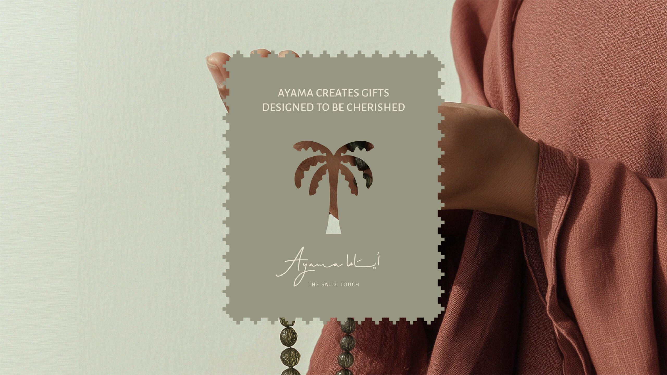 Ayama brand mark shown on a Saudi-inspired card layout for premium gifting Caption: Brand mark application for packaging and print