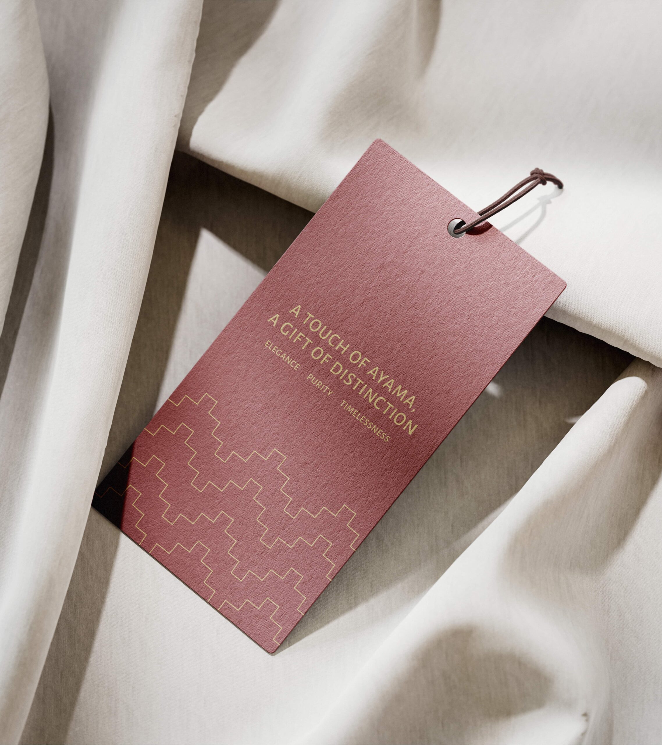 Hang tag design concept for Ayama packaging with premium Saudi gifting styling